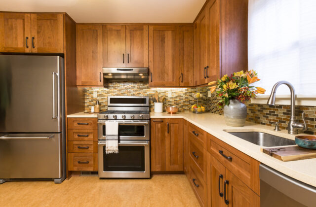 Contemporary upscale kitchen with wood cabinets and stainless steel appliances